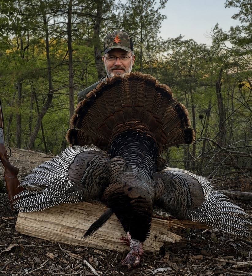 Mark outdoors with a harvested turkey