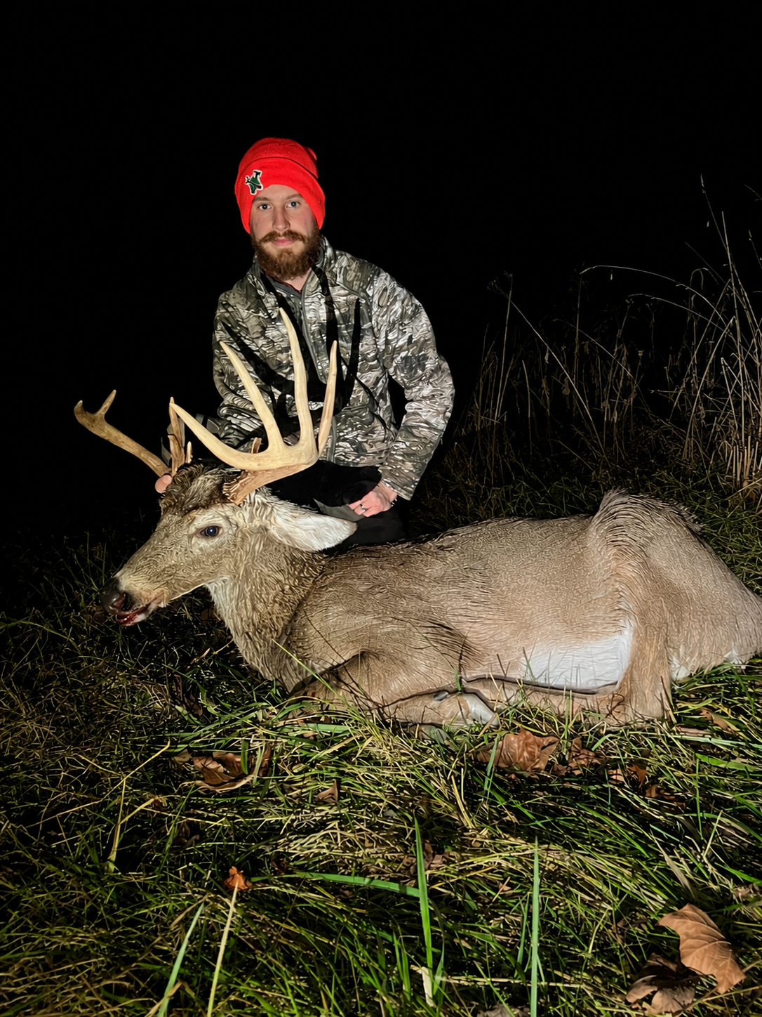 Albert outdoors with a whitetail buck