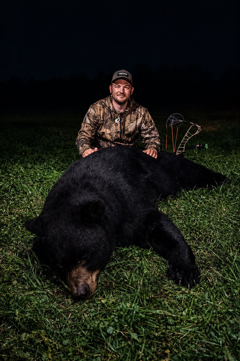 Daniel outdoors with a black bear